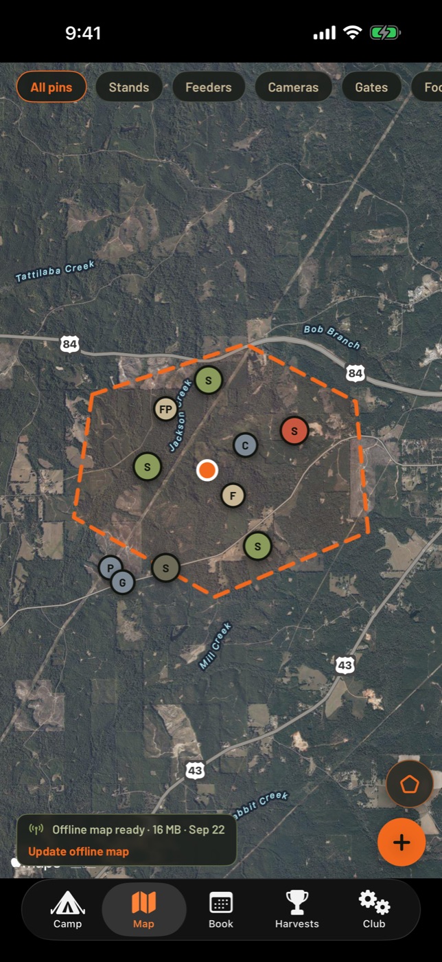 Satellite map of a hunting property with the lease boundary drawn and pins for stands, feeders, cameras and gates